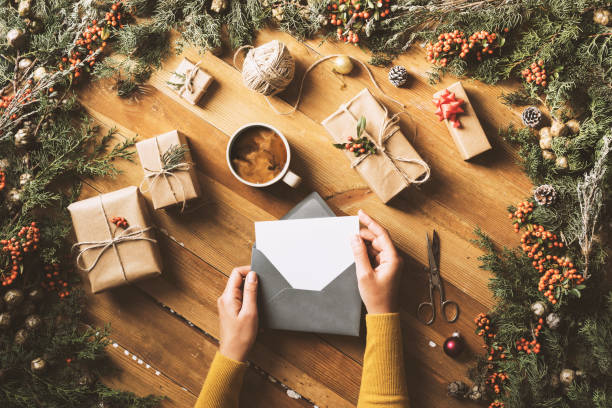 istock Writing greeting cards, New Year Christmas table top flat lay 628153404