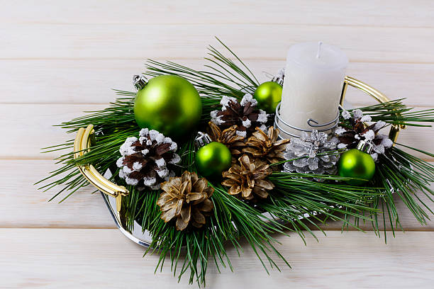 istock Christmas centerpiece with silver, snowy and bleached pine cones 628154202
