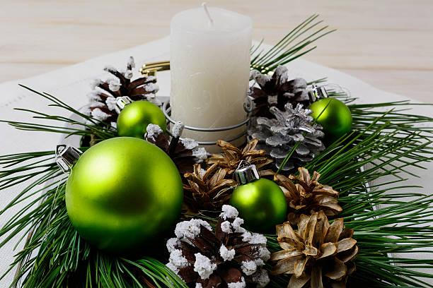 istock Christmas green ornaments and snowy pinecone decoration 628154590