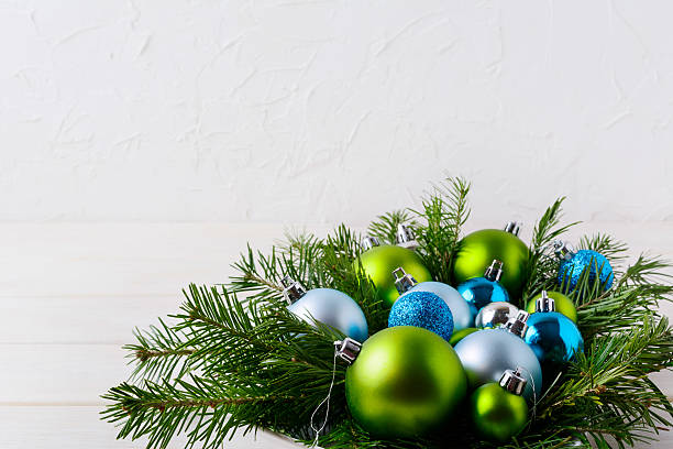 istock Christmas table centerpiece with light blue, glitter and green o 628155274