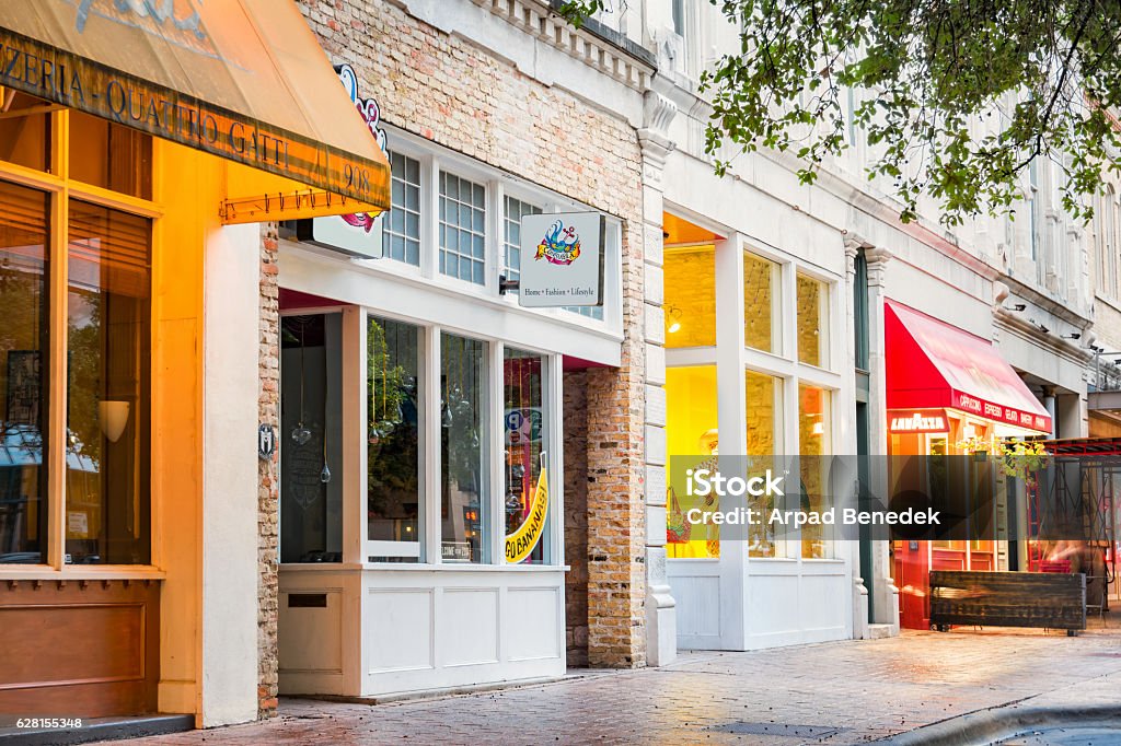 Colorful Shops and Restaurants in Downtown Austin Texas USA Photo of a row of illuminated, colorful shops, restaurants and businesses on Congress Avenue in Downtown Austin, Texas, USA.  Store Stock Photo