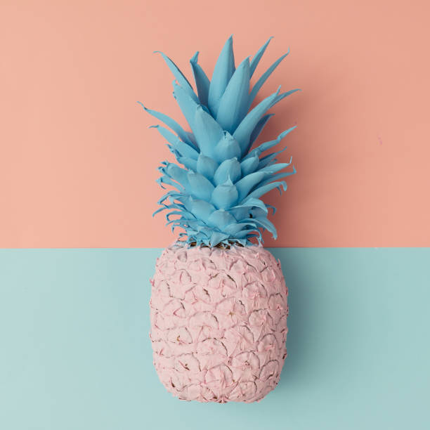 istock Pink pineapple on pink and blue pastel background. Minimal style 628155838