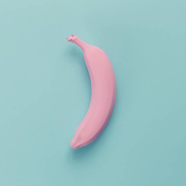 istock Pink banana on blue pastel background. Minimal style. Flat lay. 628156958