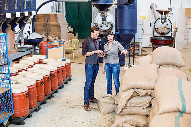 business people working at coffee roasting factory - sack burlap bag roasted imagens e fotografias de stock