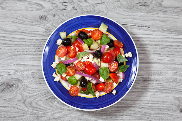 istock Greek salad in a blue plate 628158002
