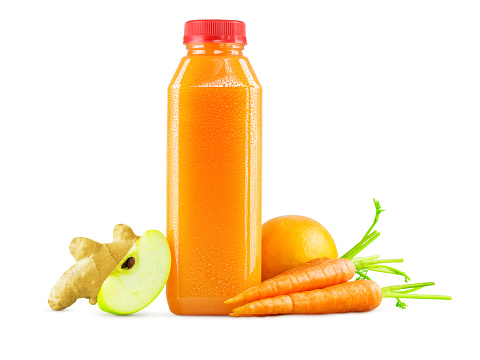 A generic bottle of freshly squeezed raw carrot, apple, orange, and ginger juice with a garnish of carrots, an apple wedge, a whole orange, and a chunk of ginger on the side. On a white background. The cold bottle of fruit and vegetable juice can accommodate any logo or brand name.