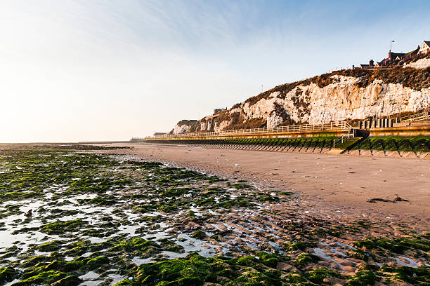 Stone Bay beach in Broadstairs, Thanet, Kent, England Stone Bay beach in Broadstairs, Thanet, Kent, South-east England. It is a sunny day in the Autumn. There are white chalk cliffs and a coast path alongside the beach. isle of thanet photos stock pictures, royalty-free photos & images