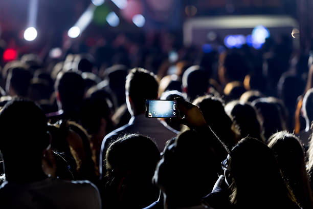 istock Hand with a smartphone records live music festiva 628159568