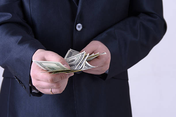 istock man in a business suit offers money 628160196