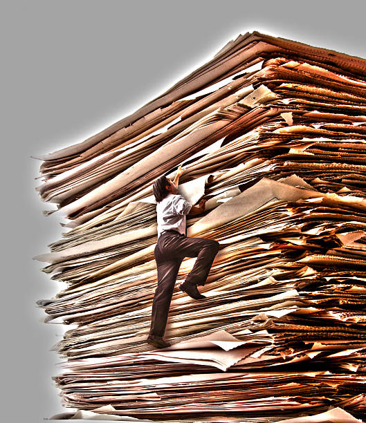 istock Climbing a Pile of Files 628161100