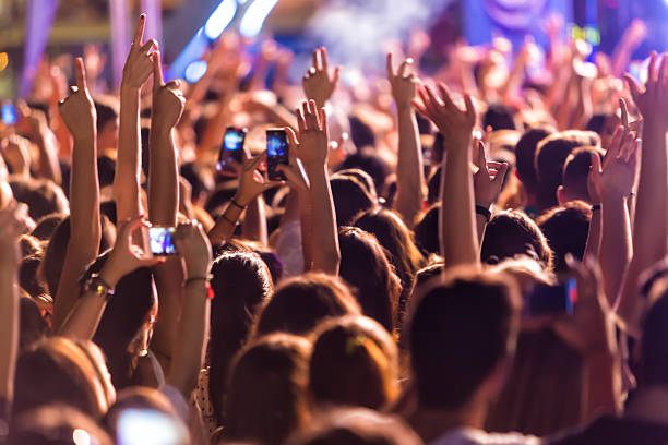 istock Hand with a smartphone records live music festiva 628161192