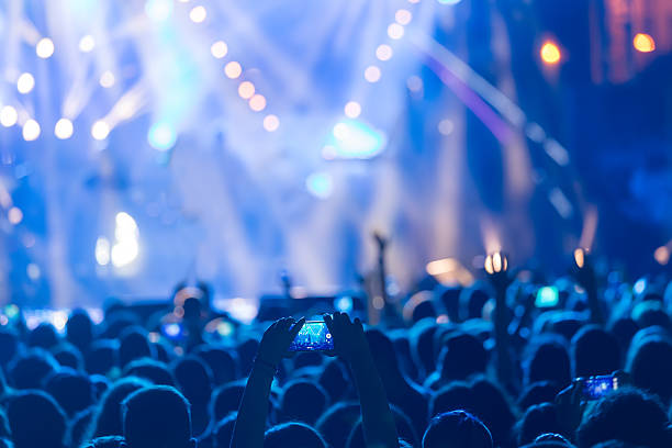 istock Hand with a smartphone records live music festiva 628161310