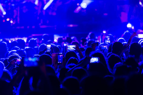 istock Hand with a smartphone records live music festiva 628161486