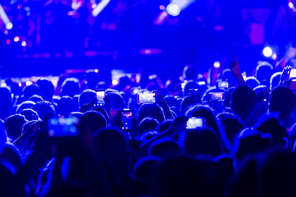 istock Hand with a smartphone records live music festiva 628161520