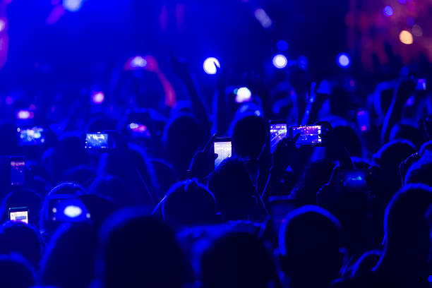 istock Hand with a smartphone records live music festiva 628161556