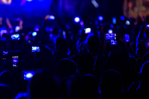 istock Hand with a smartphone records live music festiva 628161660