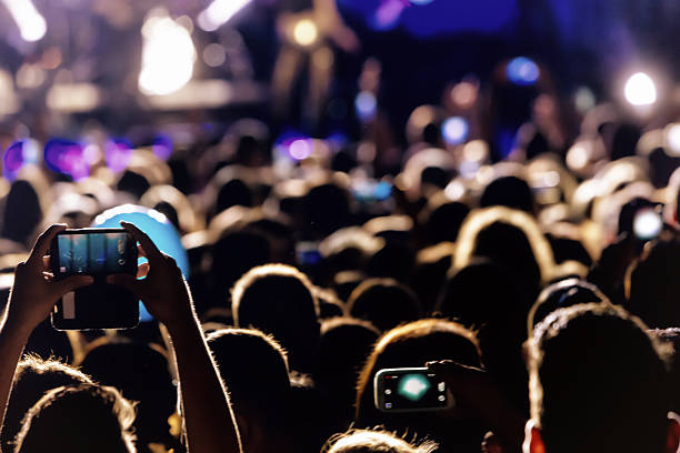 istock Hand with a smartphone records live music festiva 628161718
