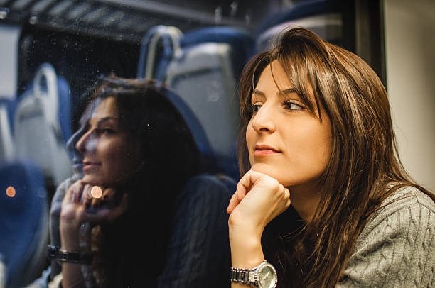 istock Girl looking out the window 628162484