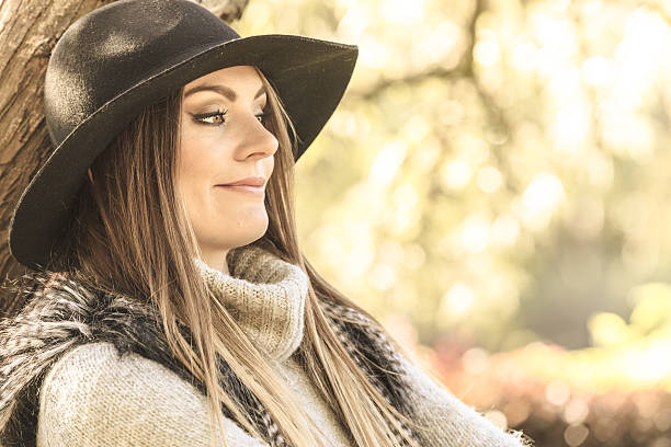 istock Beautiful autumnal woman in park 628162654