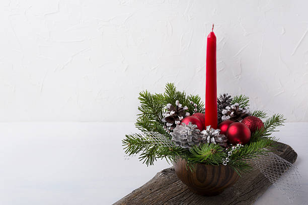 istock Christmas background with red candle and ornaments centerpiece 628167144