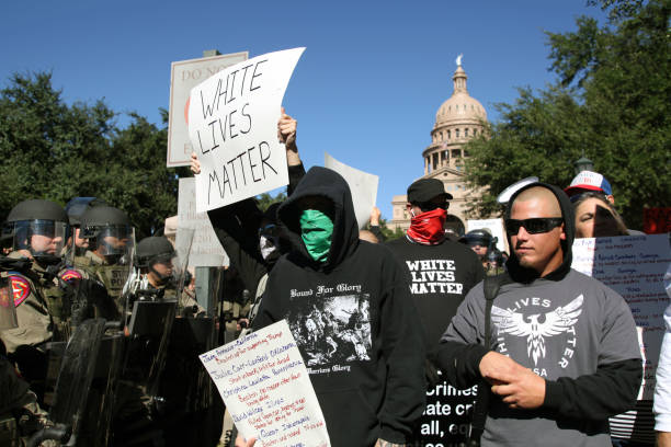 Austin, Texas, USA - November 19, 2016: A group of 'White Lives Matter' demonstrators protest just south of the Capitol grounds. The 'White Lives Matter' demonstrators, numbering about 20 people at the most, came from Houston with the message that the hate crime law is unfair to white people.