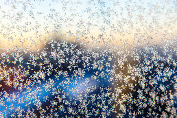 istock Little frosty patterns on glass, 628168944