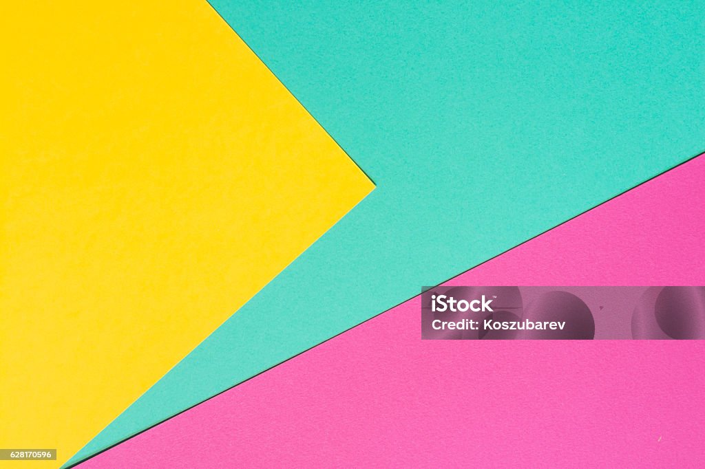 Colored paper in a geometric flat composition. Coloured sheets. Turquoise, pink and yellow conceptual background Pop Art Stock Photo