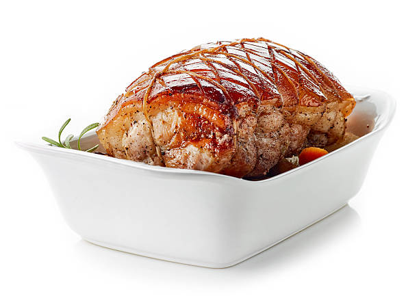 roasted pork on white background roasted pork in roaster pan isolated on white background celebrity roast stock pictures, royalty-free photos & images