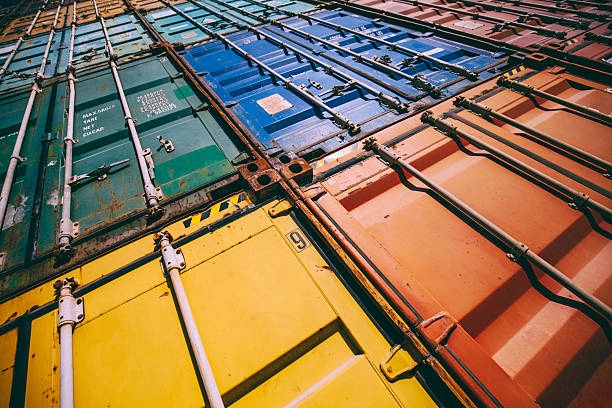Stack of colorful cargo containers at the dock Background detail of colorful cargo freights container stacks in shipping port wine shipping stock pictures, royalty-free photos & images