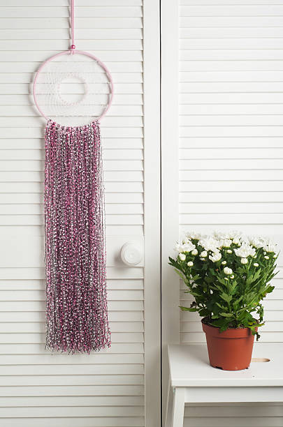 istock Pink dream catcher with flowers 628192150
