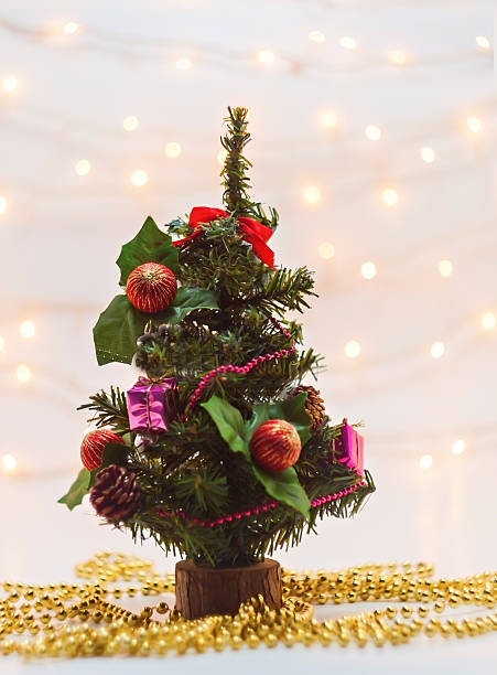 istock small tree with toys and gifts on background blur lights 628192624