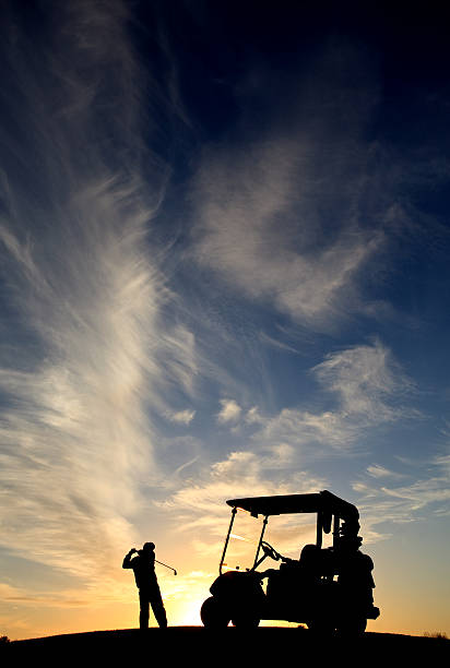 istock Junior Golfer Silhouette With Golf Cart 628192630