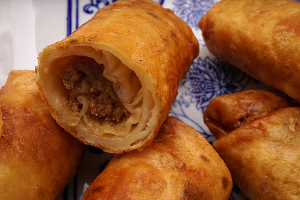 istock Chinese food. Meat and vegetable spring rolls 628193072