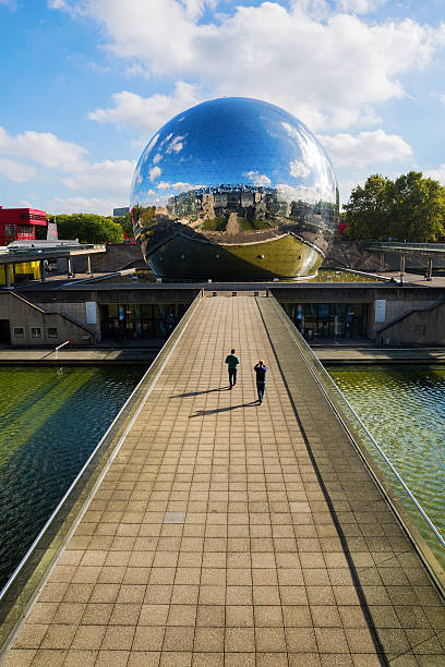 La Geode in the Parc de la Villette in Paris Paris, France - October 15, 2016: La Geode in the Parc de la Villette with unidentified people. Its a mirror-finished geodesic dome with an Omnimax theatre at the Cite des Sciences et de l Industrie la geode stock pictures, royalty-free photos & images