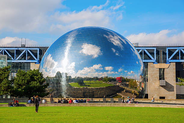 La Geode in the Parc de la Villette in Paris Paris, France - October 15, 2016: La Geode in the Parc de la Villette with unidentified people. Its a mirror-finished geodesic dome with an Omnimax theatre at the Cite des Sciences et de l Industrie geode photos stock pictures, royalty-free photos & images