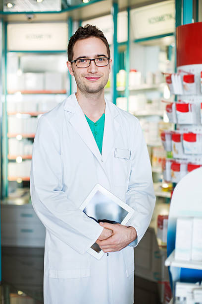 istock Chemist with digital tablet at the hospital pharmacy 628193974