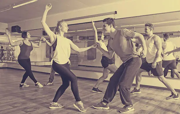 Photo of Girls and men learning swing