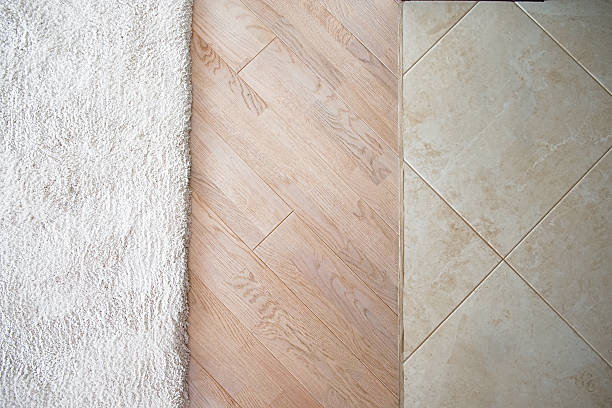 istock Floor with marble tile pattern, laminate parquete floor with beige soft carpet 628196578