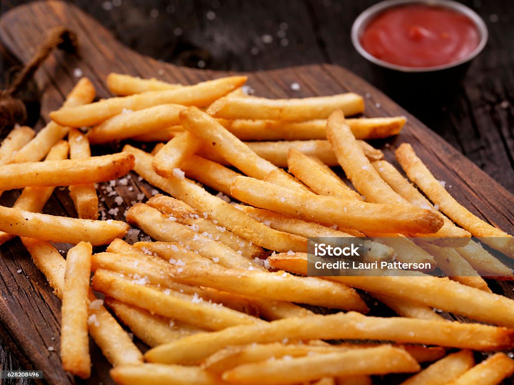 Sea Salt French Fries with Ketchup Sea Salt French Fries with Ketchup  - Photographed on Hasselblad H3D2-39mb Camera French Fries Stock Photo