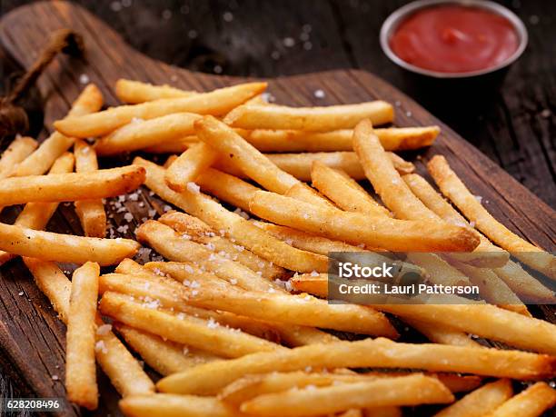 Sea Salt French Fries With Ketchup Stock Photo - Download Image Now - French Fries, Heat - Temperature, Salt - Seasoning