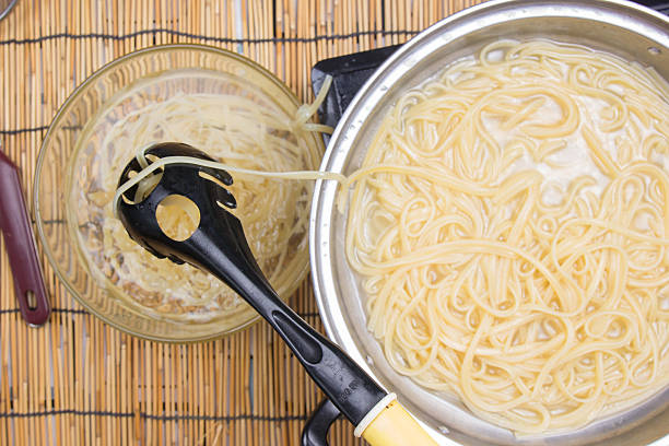 istock Spaghetti lifted on of cold water 628208702