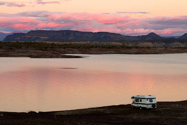 Camper Parked on Lake Pleasant Shoreline A travel camper is parked on the shoreline of Lake Pleasant, a reservoir near Phoenix, Arizona. sonoran desert stock pictures, royalty-free photos & images