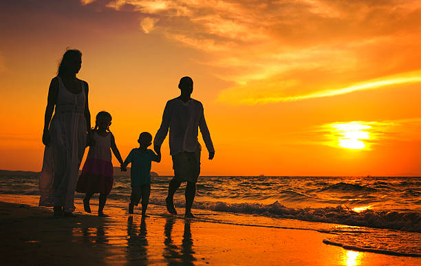 istock Family walking on the beach happiness Concept 628216516
