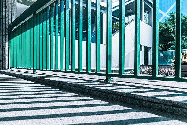 istock shadow of steel railings 628217482