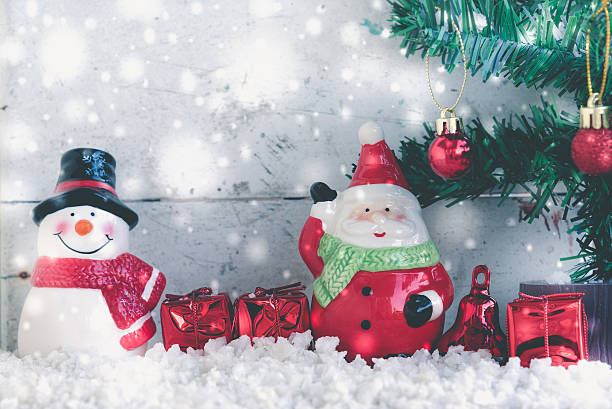 istock Christmas background with santa claus and snowman 628217712