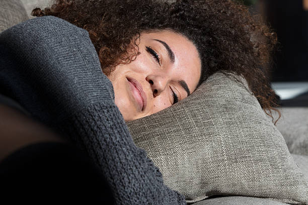 istock raylight kissing young sleeping woman's face 628217946