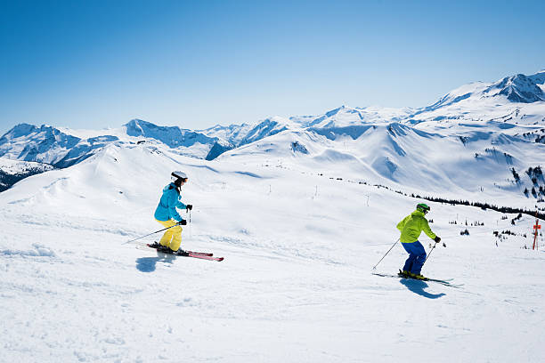 istock Couple skiing on a sunny day 628218206