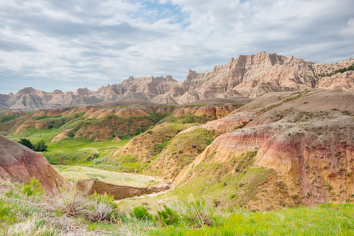 This is a horizontal, color, royalty free photograph of the majestic mountain and canyon scenic landscape in Badlands National Park South Dakota. Photographed with a Nikon D800 DSLR.