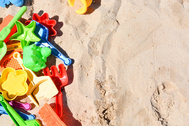 istock Many colorful beach toys in sand 628220740