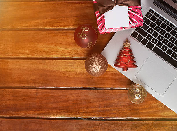istock wooden table with christmas decorations 628221602